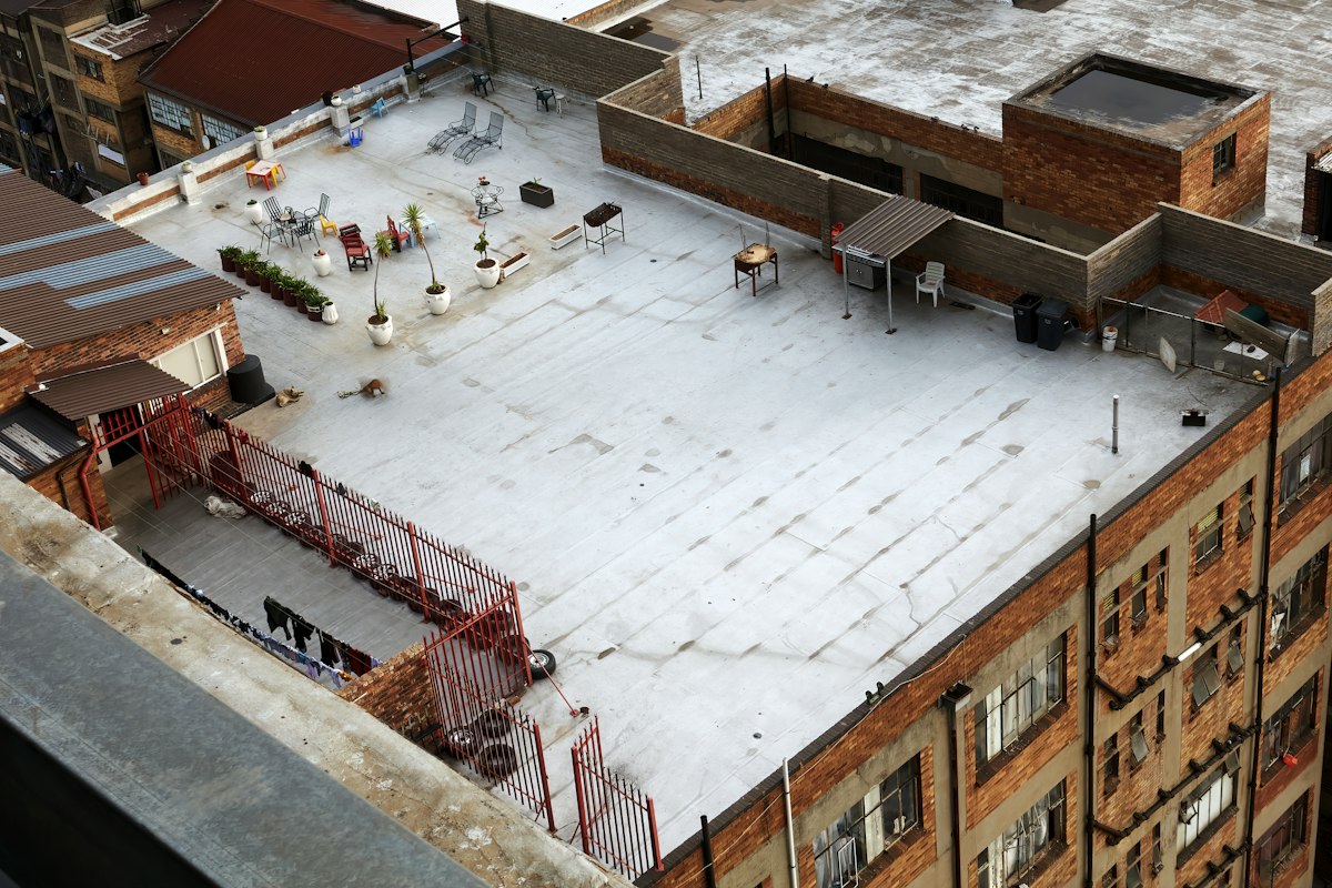 Aerial view of a white TPO membrane flat roof on a commercial building